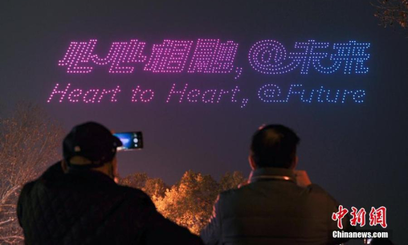 Over 1,000 illuminated drones display a pattern of