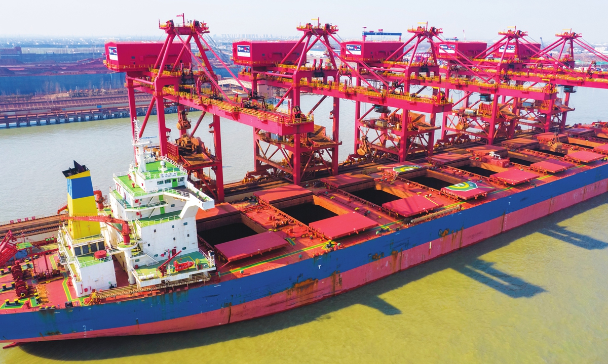 A ship unloads imported iron ore at the port of Taicang, East China's Jiangsu Province, on February 21, 2022. China's iron ore imports dropped in 2021, declining 4.3 percent from the previous year's record high, official data showed. Photo: cnsphoto
