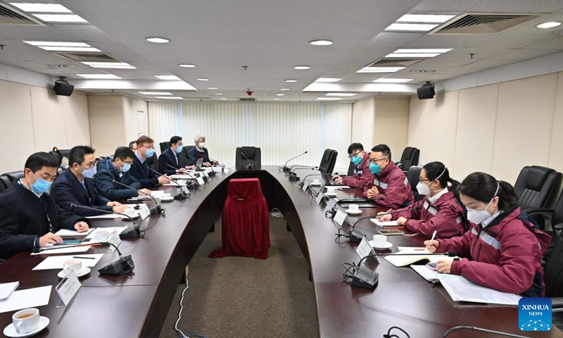 The team of the mainland epidemiological experts exchange views with representatives from the Food and Health Bureau of the Hong Kong Special Administrative Region (HKSAR) government, in south China's Hong Kong, Feb. 20, 2022.Photo:Xinhua