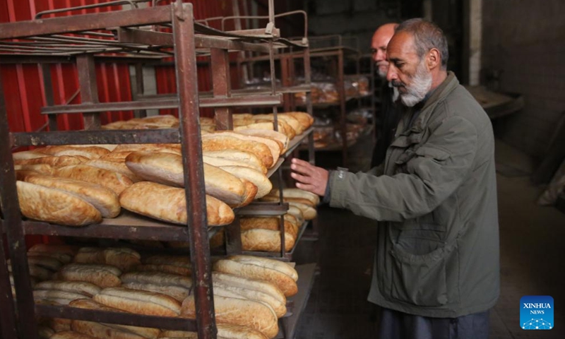 Staff members work at the Afghan state-owned bread factory, Silo-e-Markazi or central silo, in Kabul, capital of Afghanistan, Feb. 20, 2022. Photo: Xinhua