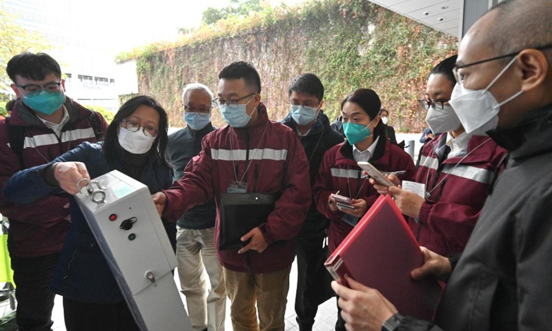 The team of the mainland epidemiological experts is briefed on Hong Kong's sewage surveillance program in south China's Hong Kong, Feb. 20, 2022.Photo:Xinhua
