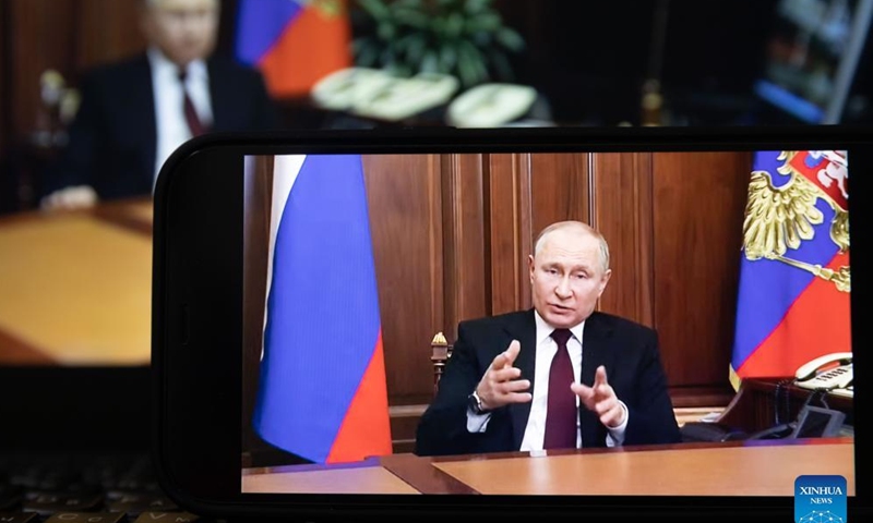 Photo taken on Feb. 21, 2022 shows a screen displaying Russian President Vladimir Putin speaking during a televised address to the nation in Moscow, Russia. Russian President Vladimir Putin announced on Monday that he has signed a decree recognizing the Lugansk People's Republic (LPR) and the Donetsk People's Republic (DPR) as independent and sovereign states. (Xinhua/Bai Xueqi)