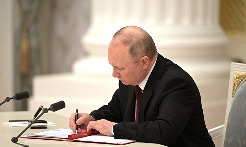 Russian President Vladimir Putin signs documents recognizing the Donetsk and Lugansk People's Republics at the Kremlin in Moscow on Feb. 21, 2022.(Photo: Xinhua)