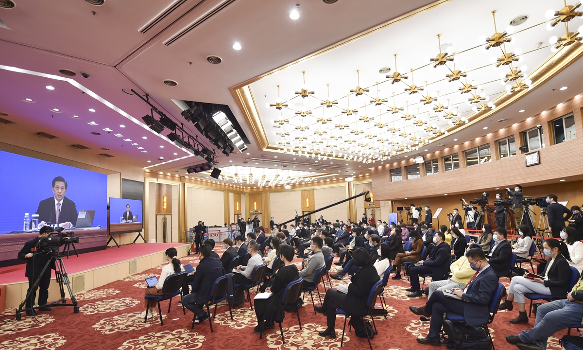 Zhang Yesui, spokesperson for the fifth session of the 13th National People's Congress, takes reporters' questions via video link on March 4, 2022. Photo: Xinhua