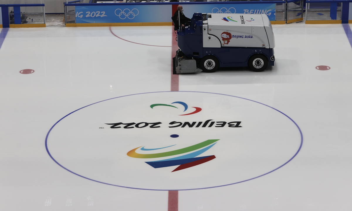An ice-making team works to maintain the logo of the Beijing 2022 Paralympic Winter Games at the National Stadium on February 23, 2022. Photo: VCG