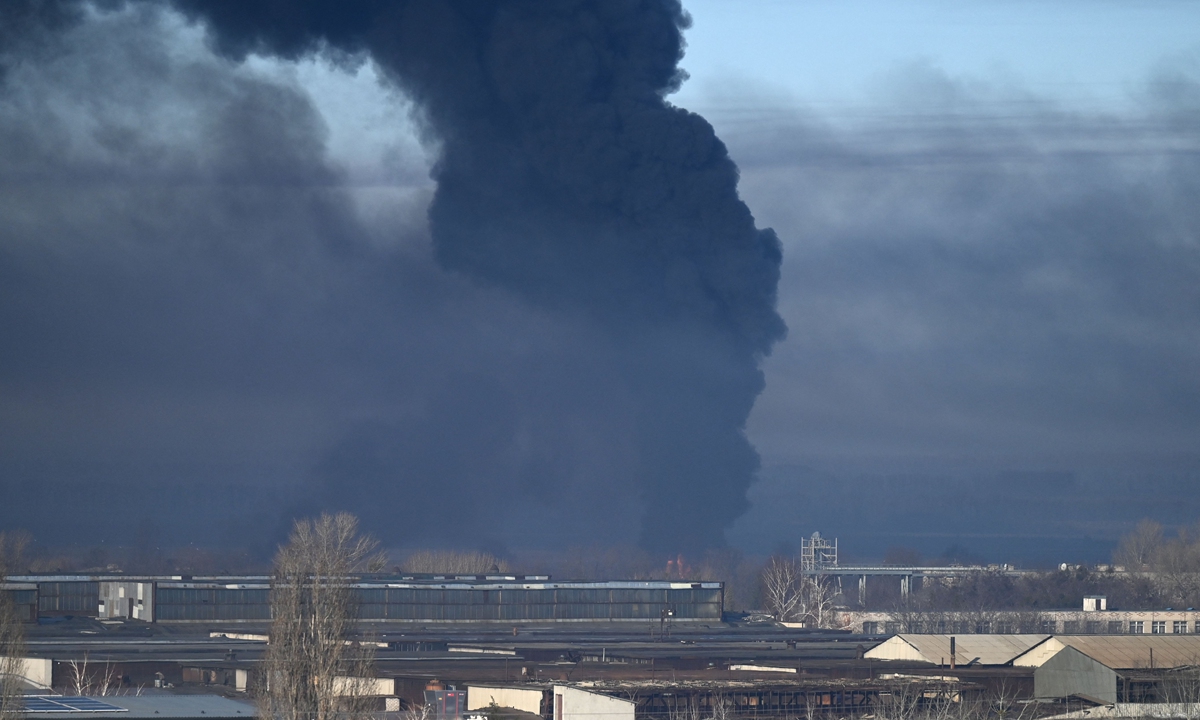 Black smoke rises from a military airport in Chuguyev near Kharkiv on February 24, 2022, after Russian President Vladimir Putin announced a military operation in Ukraine. Photo: VCG   