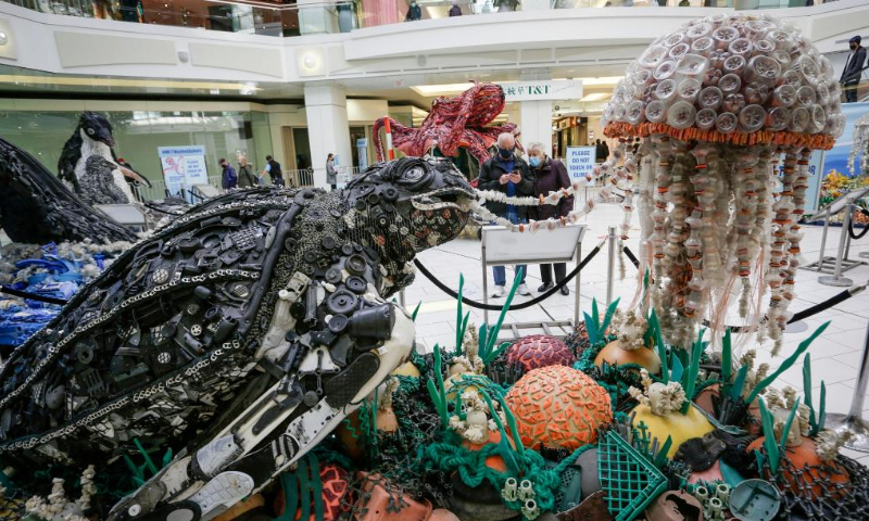 An art sculpture made from plastic marine debris is displayed at the 
