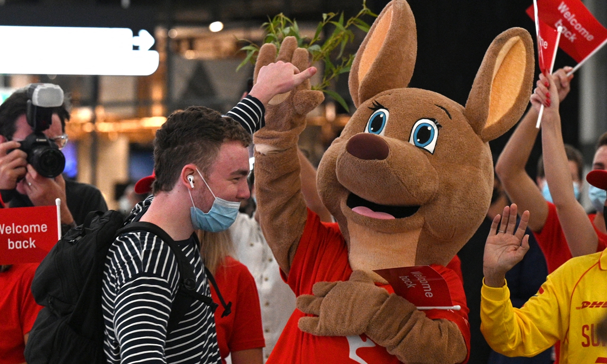 A mascot welcomes passengers upon arrival at the Sydney International Airport on February 21, 2022. Photo: AFP