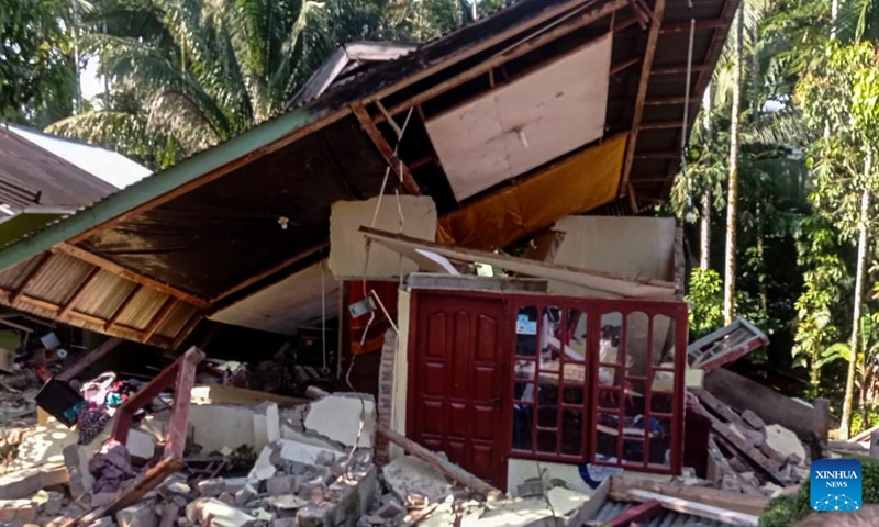 Photo taken with mobile phone shows a damaged house after a 6.2-magnitude earthquake at Pasaman Barat district in West Sumatra, Indonesia, Feb. 25, 2022.Photo:Xinhua