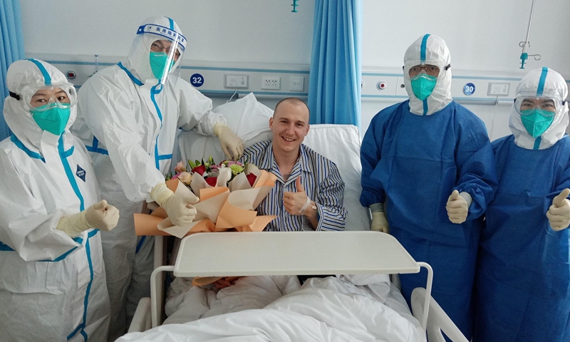 Photo of Mateusz Sochowicz with Chinese doctors and nurses in hospital in Beijing on Nov. 9, 2021. (Xinhua via Beijing 2022 Organizing Committee)