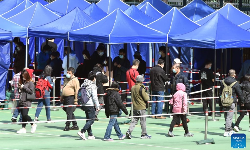 Citizens wearing face masks are seen at a park in Hong Kong, south China, Feb. 25, 2022. Hong Kong reported 10,010 new COVID-19 cases and 47 deaths on Friday, official data showed.Photo:Xinhua