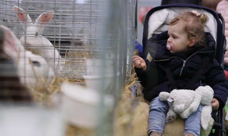 A child visits the 58th International Agriculture Fair at the Porte de Versailles exhibition center in Paris, France, Feb. 26, 2022.Photo:Xinhua
