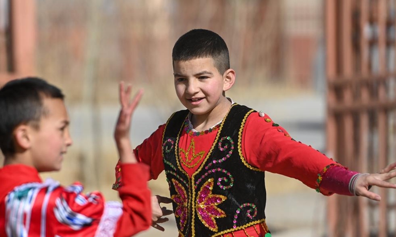 Children dance in Rasekam Village of Taxkorgan Tajik Autonomous County, northwest China's Xinjiang Uygur Autonomous Region, Feb. 24, 2022.Photo:Xinhua