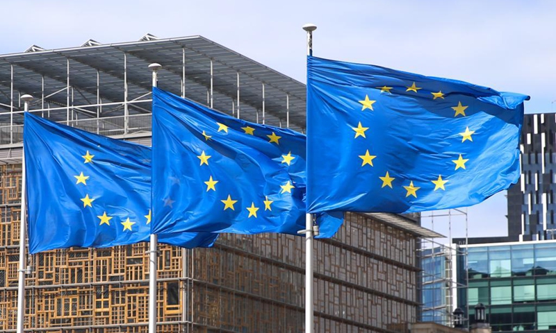 Flags of the European Union fly outside the EU headquarters in Brussels, Belgium, May 21, 2021. The European Union (EU) recommended on Thursday to open its external borders to non-essential travel into the bloc if travellers have been fully vaccinated against COVID-19. (Xinhua/Zheng Huansong)