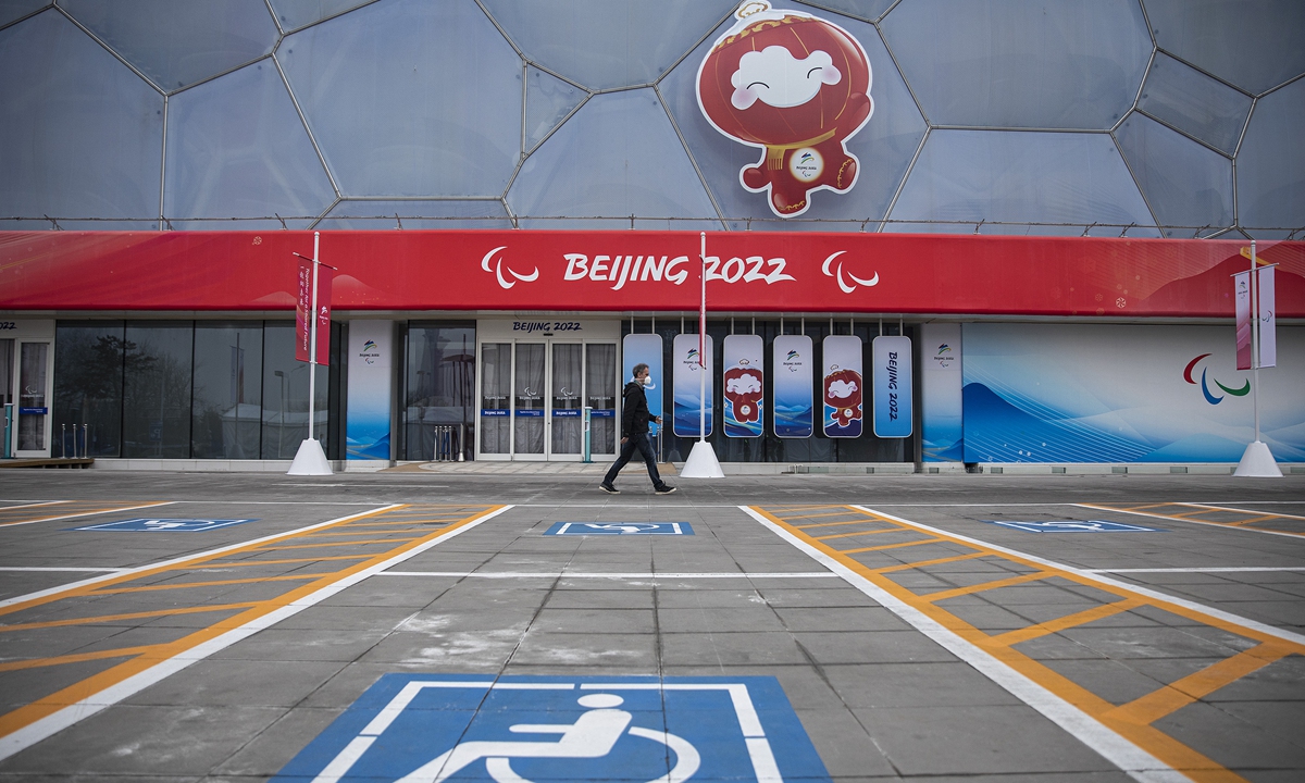 A man walks in front of a general view of the National Aquatics Center on February 28, 2022 in Beijing, China.Photo: VCG