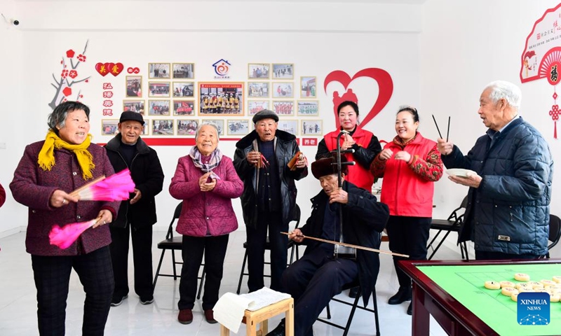 People enjoy themselves at a care center for the elderly in Huangjiayu Village of Lanshan District, Rizhao, east China's Shandong Province, Feb. 27, 2022. Lanshan District of Rizhao City has set up care centers since 2021, providing assistance and care to the elderly people over 60 years old. (Photo: Xinhua)