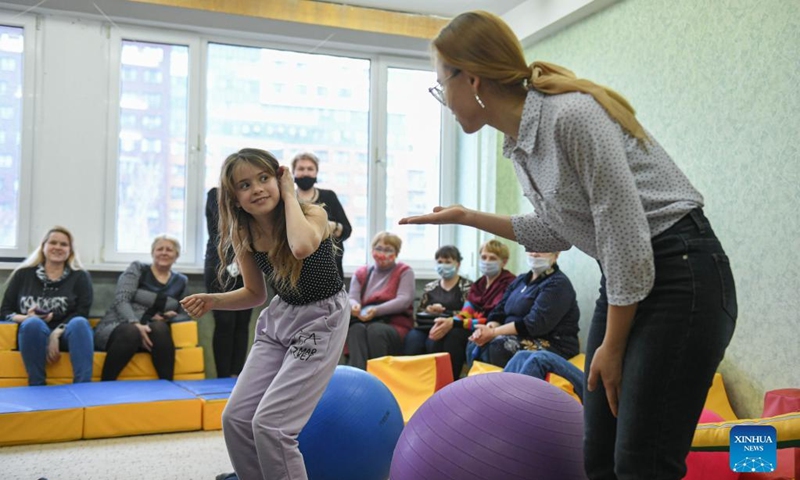 Children from Donbass play with a volunteer at an accommodation site in a university dormitory in Rostov-on-Don, Russia, on Feb. 28, 2022. (Xinhua/Evgeny Sinitsyn)
