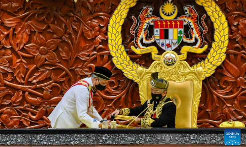 Malaysia's King Sultan Abdullah Sultan Ahmad Shah (R) receives documents from Prime Minister Ismail Sabri Yaakob during the opening of the parliament session in Kuala Lumpur, Malaysia, Feb. 28, 2022. Malaysia's first parliament session of the year convened on Monday as the country seeks to recover from the effects of COVID-19 while coping with an Omicron fueled pandemic surge. (Photo: Xinhua)