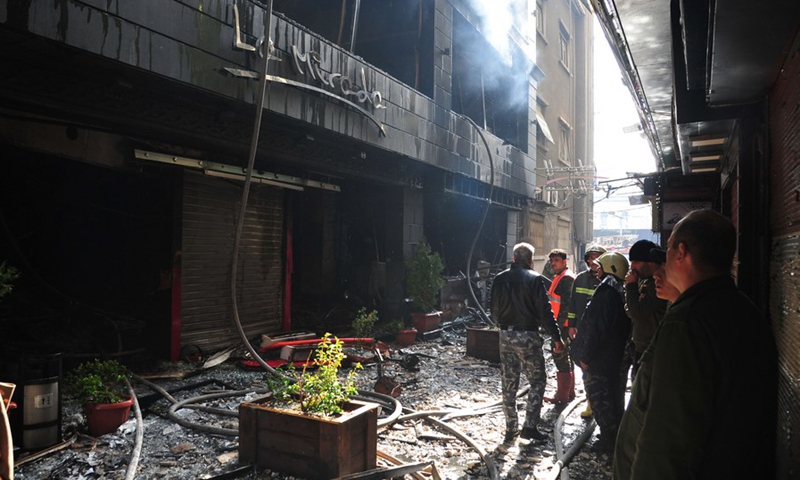 Firefighters are seen working after a huge fire broke out at Lamirada shopping mall in Hamra market in the heart of the capital Damascus on March 1, 2022. (Photo: Xinhua)
