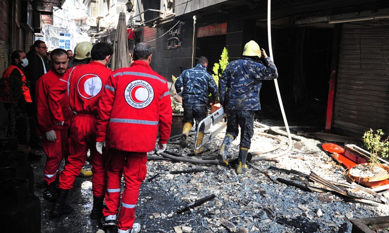 Firefighters are seen working after a huge fire broke out at the Lamirada shopping mall at Hamra marketplace in the heart of the capital Damascus on March 1, 2022.(Photo: Xinhua)