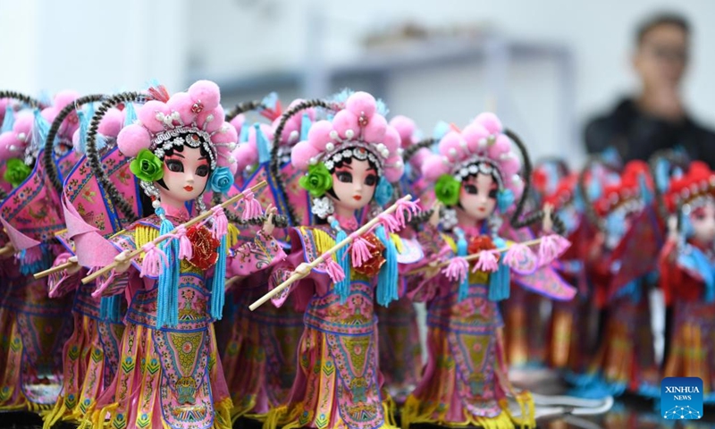 Workers assemble Tang dolls at a workshop in Huishui County of Qiannan Buyi and Miao Autonomous Prefecture, southwest China's Guizhou Province, March 1, 2022.Photo:Xinhua