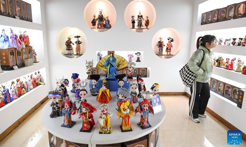 Workers assemble Tang dolls at a workshop in Huishui County of Qiannan Buyi and Miao Autonomous Prefecture, southwest China's Guizhou Province, March 1, 2022.Photo:Xinhua