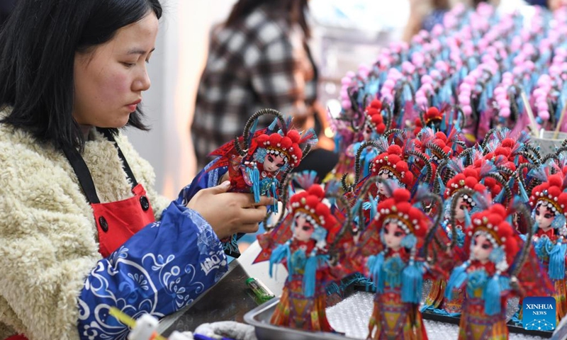 Workers assemble Tang dolls at a workshop in Huishui County of Qiannan Buyi and Miao Autonomous Prefecture, southwest China's Guizhou Province, March 1, 2022.Photo:Xinhua