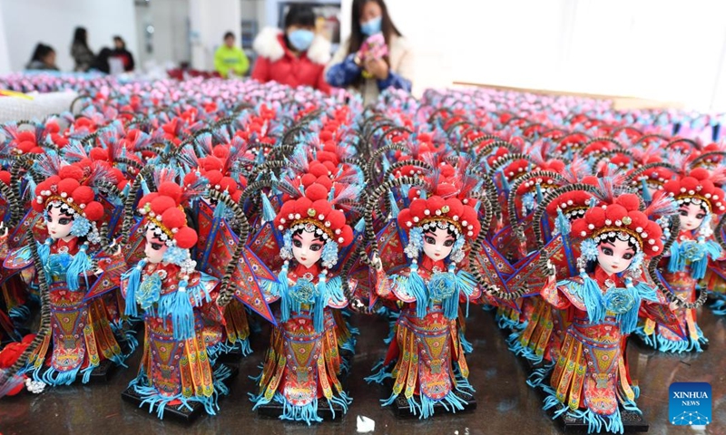 Workers assemble Tang dolls at a workshop in Huishui County of Qiannan Buyi and Miao Autonomous Prefecture, southwest China's Guizhou Province, March 1, 2022.Photo:Xinhua