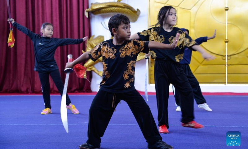Children practice Chinese martial arts at Harmony Wushu Indonesia in Bogor, Indonesia, March 5, 2022.Photo:Xinhua