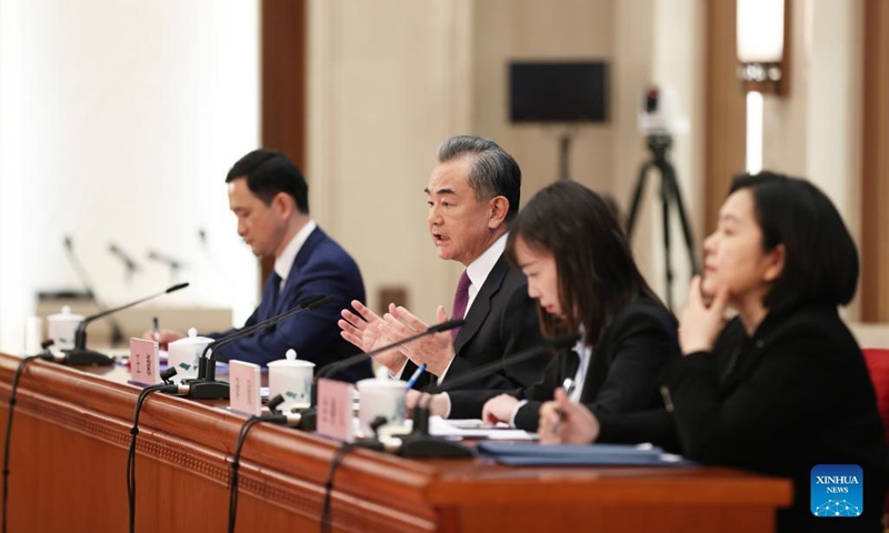 Chinese State Councilor and Foreign Minister Wang Yi attends a press conference on China's foreign policy and foreign relations via video link on the sidelines of the fifth session of the 13th National People's Congress (NPC) at the Great Hall of the People in Beijing, capital of China, March 7, 2022. (Xinhua/Jin Liwang)