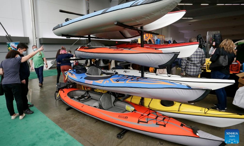 People look at kayaks at the Vancouver Outdoor Adventure and Travel Show in Vancouver, British Columbia, Canada, on March 5, 2022.Photo:Xinhua