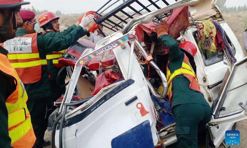 Photo taken with mobile phone shows rescuers working at the accident site in Layyah of Pakistan's east Punjab province on March 6, 2022. Six people were killed and 15 others injured in a road accident in Pakistan's east Punjab province on Sunday, local media reported. (Str/Xinhua)
