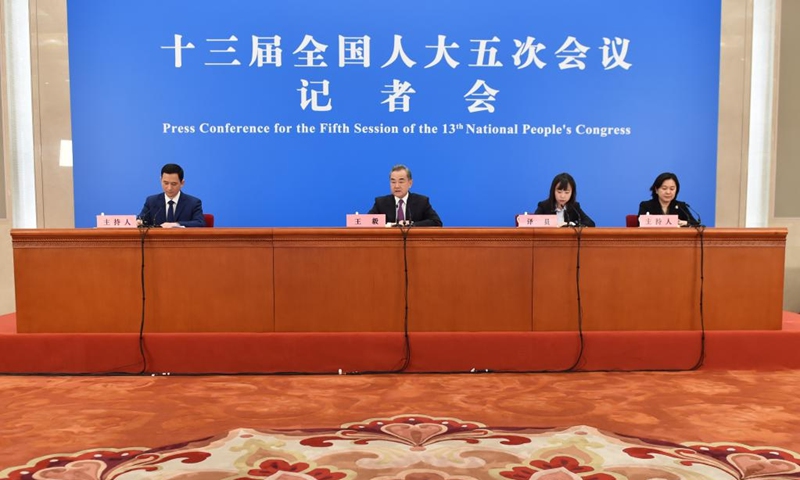 Chinese State Councilor and Foreign Minister Wang Yi attends a press conference on China's foreign policy and foreign relations via video link on the sidelines of the fifth session of the 13th National People's Congress (NPC) at the Great Hall of the People in Beijing, capital of China, March 7, 2022. (Xinhua/Chen Zhonghao)