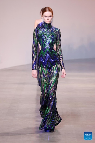 A model presents a creation of Hermes' Fall/Winter 2022 ready-to-wear collections during Paris Fashion Week in Paris, France, on March 5, 2022.Photo:Xinhua