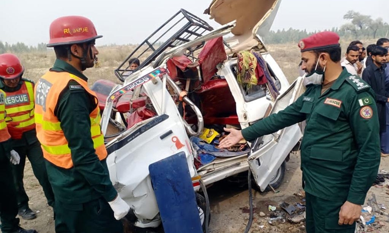 Photo taken with mobile phone shows rescuers working at the accident site in Layyah of Pakistan's east Punjab province on March 6, 2022. Six people were killed and 15 others injured in a road accident in Pakistan's east Punjab province on Sunday, local media reported. (Str/Xinhua)
