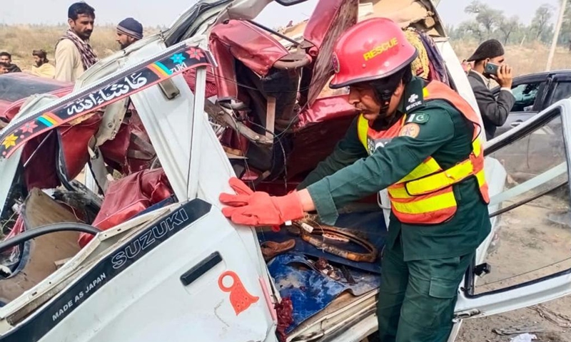 Photo taken with mobile phone shows a rescuer working at the accident site in Layyah of Pakistan's east Punjab province on March 6, 2022. Six people were killed and 15 others injured in a road accident in Pakistan's east Punjab province on Sunday, local media reported. (Str/Xinhua)