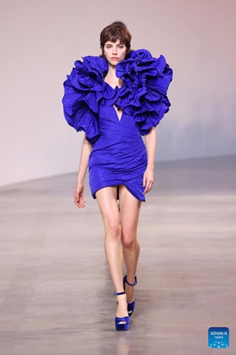 A model presents a creation of Hermes' Fall/Winter 2022 ready-to-wear collections during Paris Fashion Week in Paris, France, on March 5, 2022.Photo:Xinhua