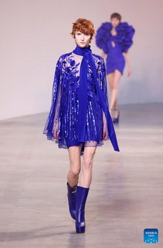 A model presents a creation of Hermes' Fall/Winter 2022 ready-to-wear collections during Paris Fashion Week in Paris, France, on March 5, 2022.Photo:Xinhua