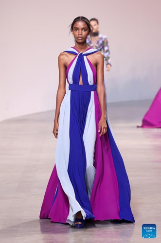 A model presents a creation of Hermes' Fall/Winter 2022 ready-to-wear collections during Paris Fashion Week in Paris, France, on March 5, 2022.Photo:Xinhua