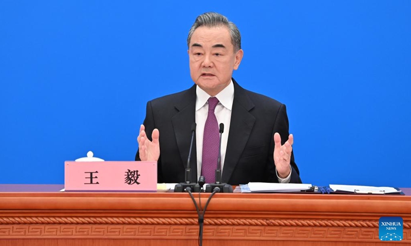 Chinese State Councilor and Foreign Minister Wang Yi attends a press conference on China's foreign policy and foreign relations via video link on the sidelines of the fifth session of the 13th National People's Congress (NPC) at the Great Hall of the People in Beijing, capital of China, March 7, 2022. (Xinhua/Li Xin)