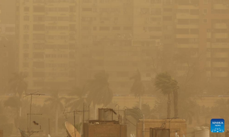 Buildings are shrouded in sand and dust during a sandstorm in Cairo, Egypt, on March 6, 2022.Photo:Xinhua