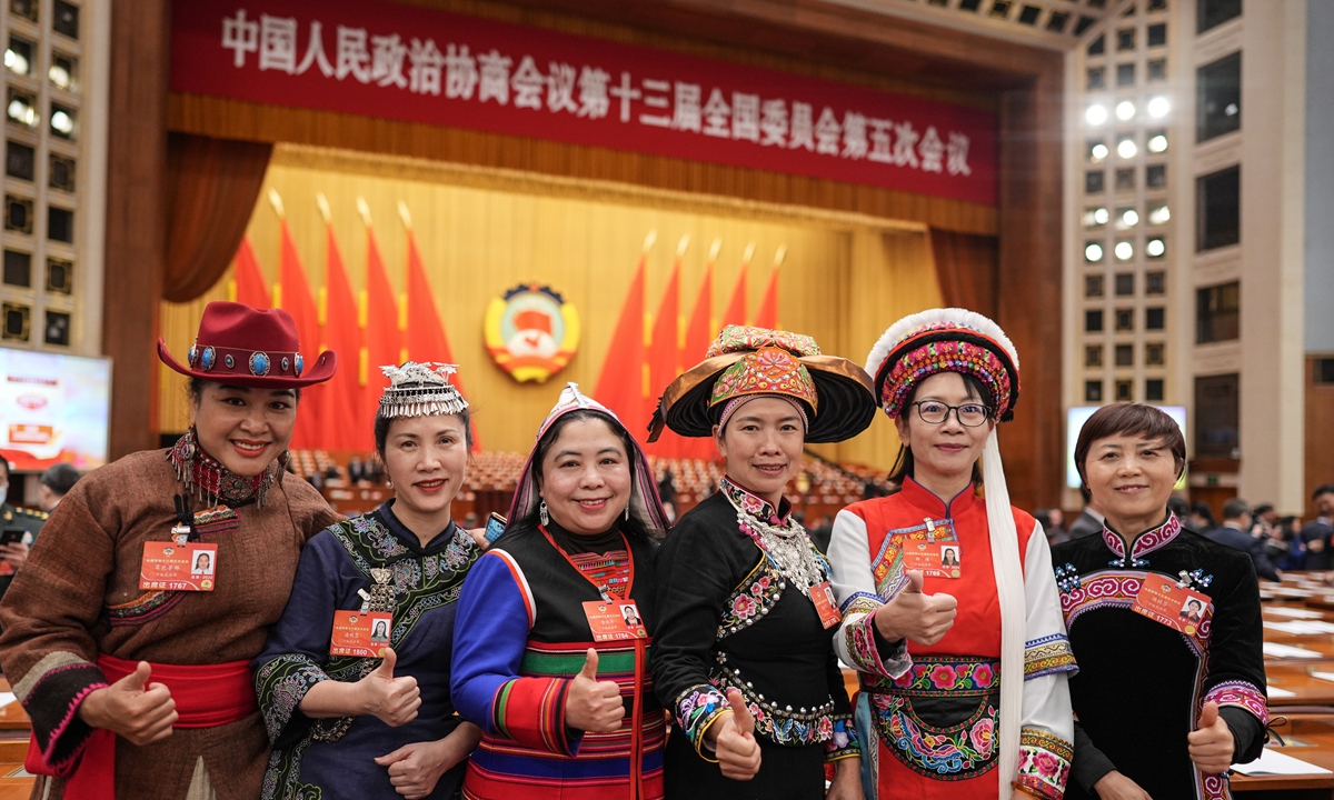 Members of the 13th National Committee of the Chinese People's Political Consultative Conference (CPPCC) pose for a picture at the second plenary meeting of the fifth session of the 13th CPPCC National Committee on March 7, 2022, one day before the International Women's Day. Photo: VCG