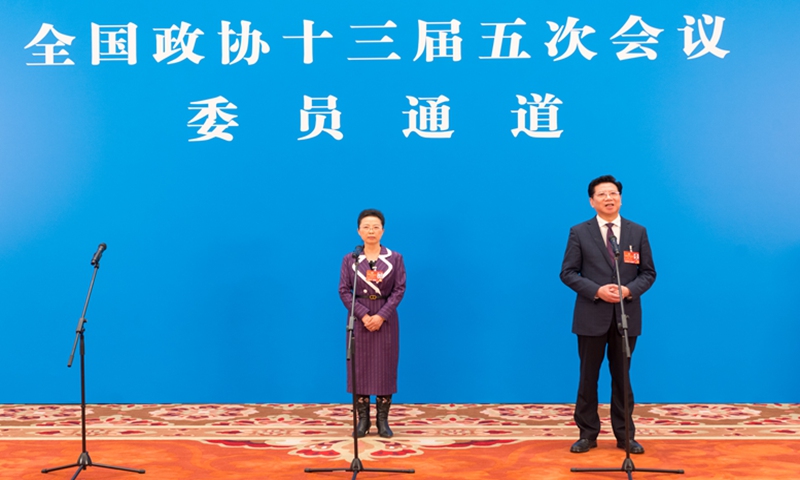 Members of the National Committee of the Chinese People's Political Consultative Conference (CPPCC) give an online video interview on March 7, 2022. Huang Gairong (L) talked about the problems of an aging society, while Hu Wei (R) discussed vocational education, ahead of the second plenary meeting of the fifth session of the 13th CPPCC National Committee. Photo: cnsphoto