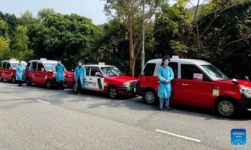 Taxi drivers of the anti-epidemic taxi fleet pose for a photo in Hong Kong, south China, March 5, 2022.
Photo:Xinhua