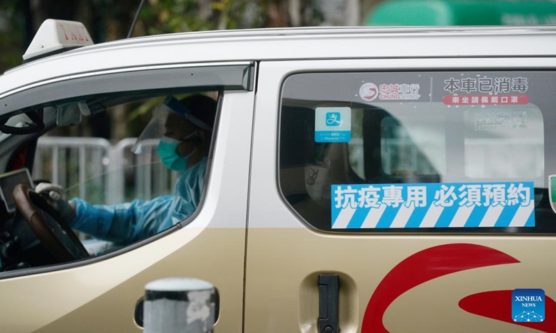 A taxi of the anti-epidemic taxi fleet stands by along a street in Hong Kong, south China, Feb. 18, 2022.Photo:Xinhua