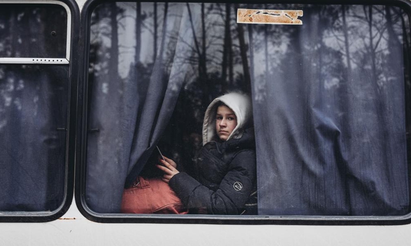 A woman sits on a bus in Irpin, Ukraine, March 5, 2022.Photo:Xinhua