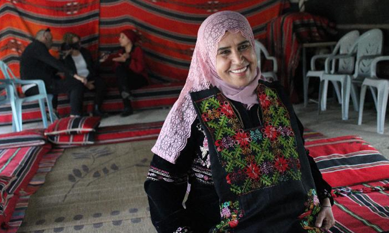 A Bedouin woman shows her embroidery work in the visitor center in Lakiya, Israel on Feb. 27, 2022.Photo:Xinhua