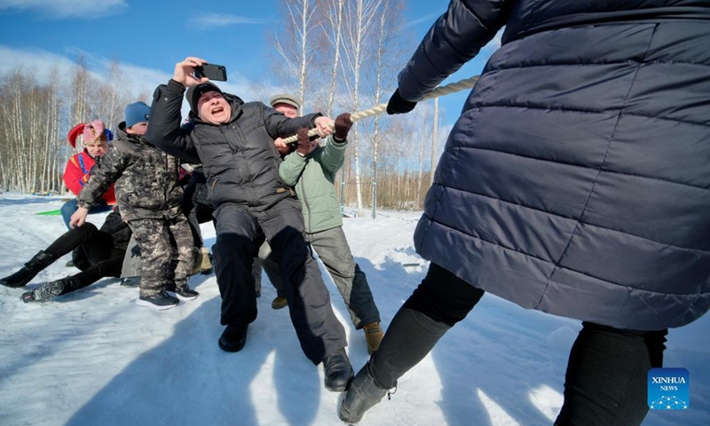 People play tug-of-war during Maslenitsa celebrations in Gamzyuki village, Kaluga region, Russia, on March 6, 2022. Maslenitsa is a traditional holiday to celebrate the beginning of spring.(Photo: Xinhua)