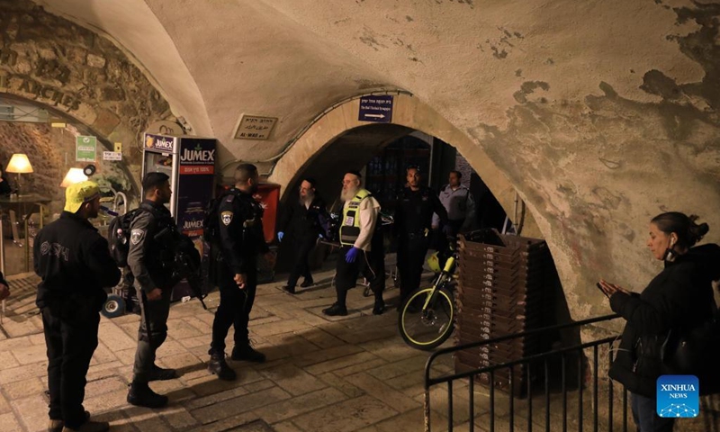 Israeli police stand guard near the scene of a stabbing attack in Jerusalem's Old City, on March 7, 2022. Israeli police said on Monday that they shot dead a man who stabbed two police officers in East Jerusalem.(Photo: Xinhua)