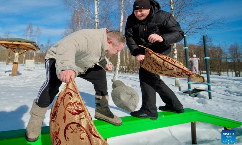 People fight with pillows during Maslenitsa celebrations in Gamzyuki village, Kaluga region, Russia, on March 6, 2022. Maslenitsa is a traditional holiday to celebrate the beginning of spring.(Photo: Xinhua)